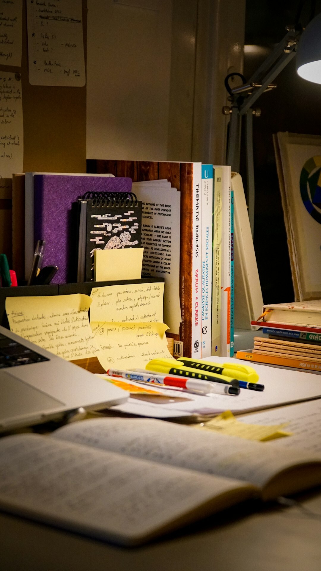 mystery writer at desk with books
